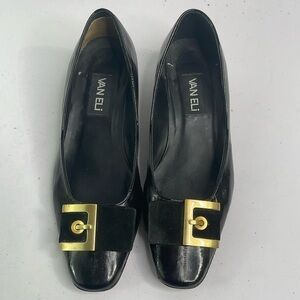 Vaneli black eel skin? Pumps w rounded square toe. Suede and gold buckle detail.